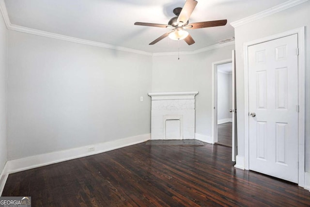 unfurnished room with ceiling fan, wood-type flooring, a premium fireplace, and ornamental molding