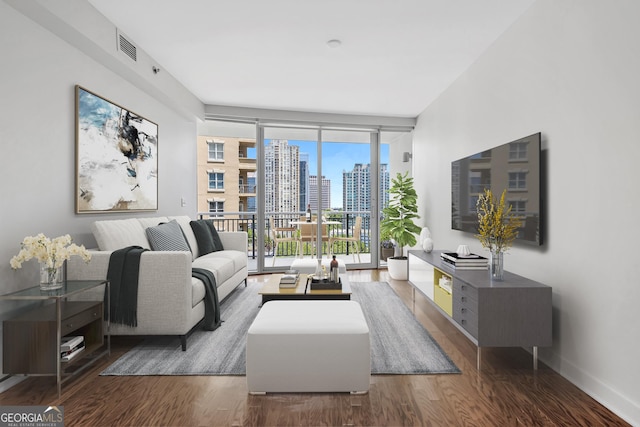 living room featuring dark hardwood / wood-style flooring and floor to ceiling windows