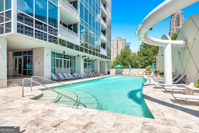 view of swimming pool featuring a patio