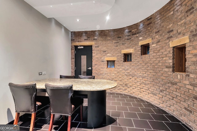 interior space with brick wall