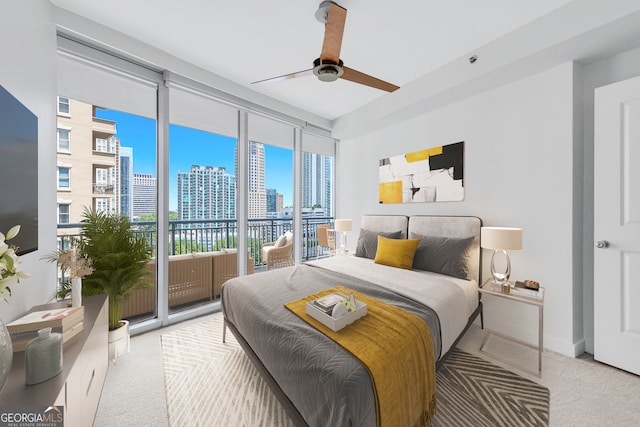 bedroom with ceiling fan, floor to ceiling windows, carpet, and access to exterior