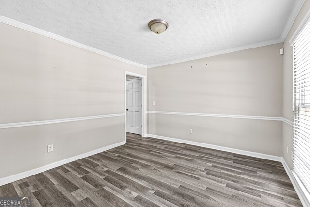 unfurnished room with a textured ceiling, crown molding, and wood-type flooring