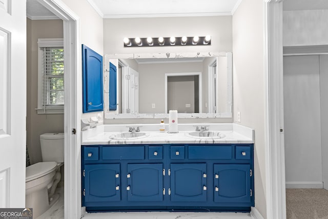 bathroom featuring crown molding, vanity, and toilet