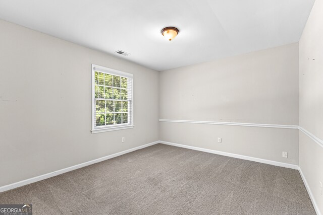 spare room with carpet flooring