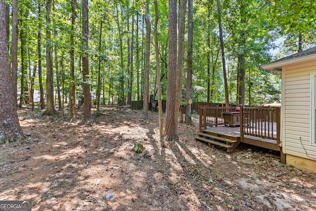 view of yard featuring a wooden deck