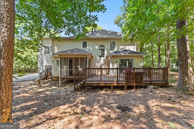 rear view of house with a deck