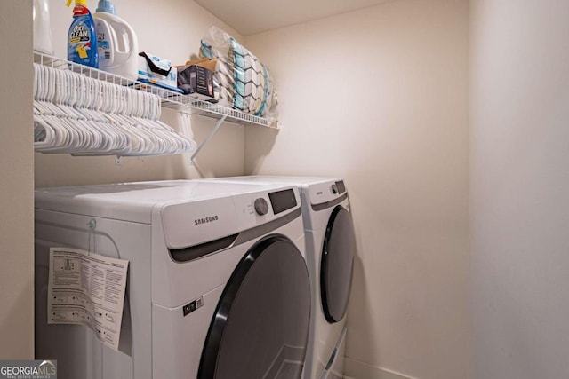 washroom featuring independent washer and dryer