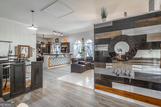 kitchen featuring ornamental molding and wood finished floors