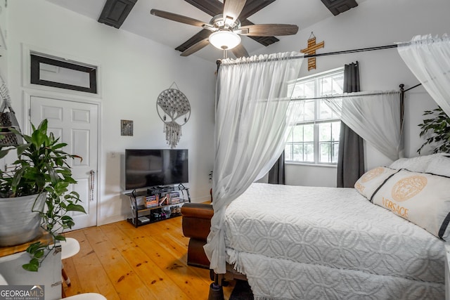 bedroom with a ceiling fan and hardwood / wood-style flooring