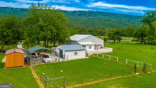 bird's eye view with a rural view and a forest view