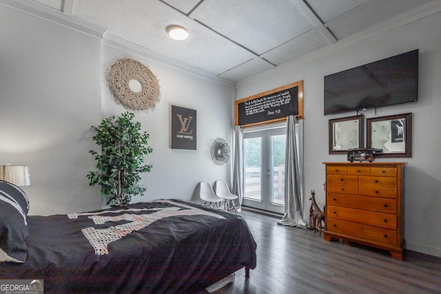 bedroom with access to exterior, crown molding, wood finished floors, and french doors