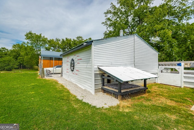 view of outbuilding with fence