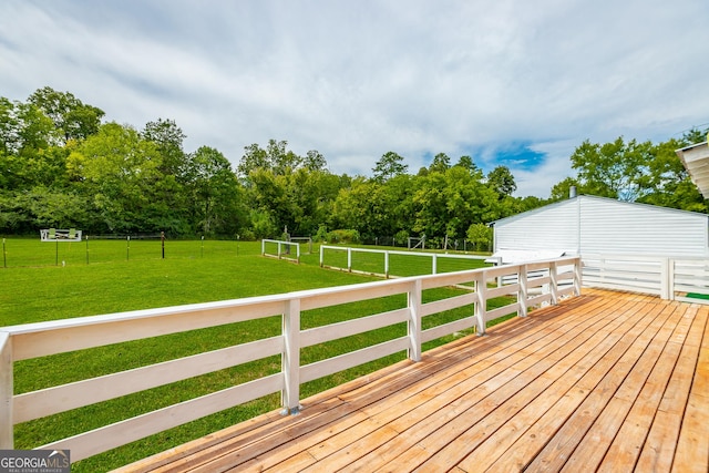 wooden deck featuring a lawn