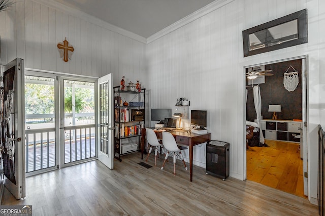 home office with crown molding and wood finished floors