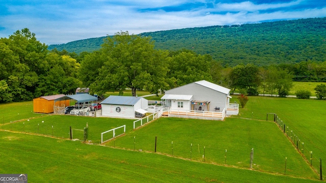 aerial view featuring a forest view and a rural view