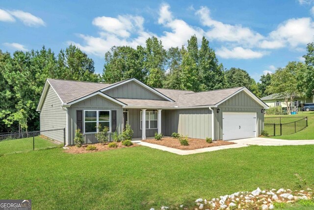 single story home featuring a garage and a front lawn