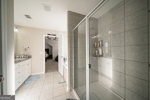 bathroom with shower with separate bathtub, tile patterned floors, and vanity