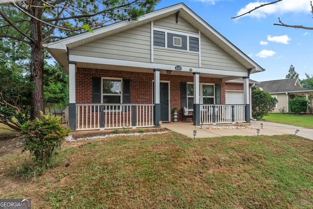 view of front of property with covered porch and a front yard