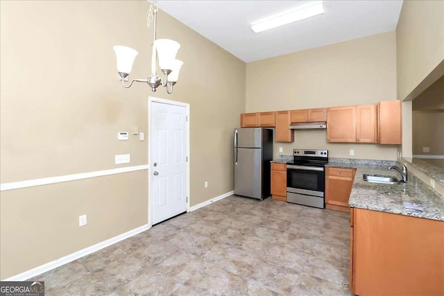 kitchen with appliances with stainless steel finishes, high vaulted ceiling, light stone counters, and light tile patterned floors