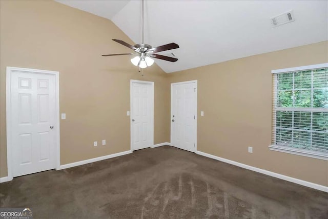 carpeted spare room featuring high vaulted ceiling and ceiling fan