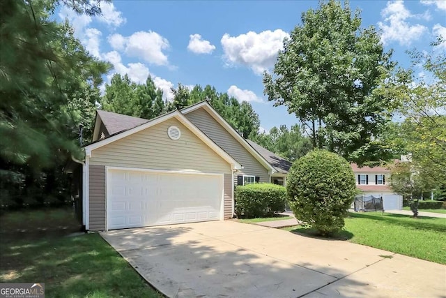 exterior space featuring a front yard and a garage