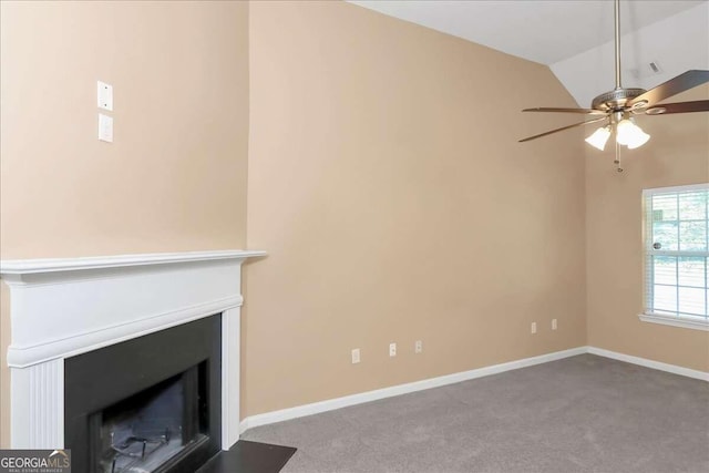 unfurnished living room with carpet, vaulted ceiling, and ceiling fan