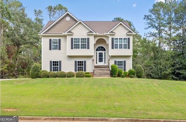 split foyer home with a front lawn