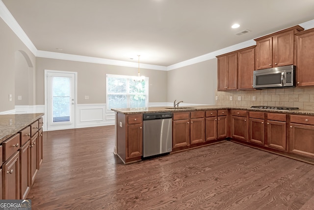 kitchen featuring decorative backsplash, dark wood-type flooring, stainless steel appliances, and ornamental molding