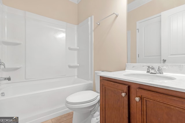 full bathroom featuring toilet, tile patterned floors, bathtub / shower combination, ornamental molding, and vanity