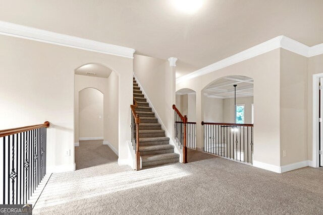 staircase featuring carpet and crown molding