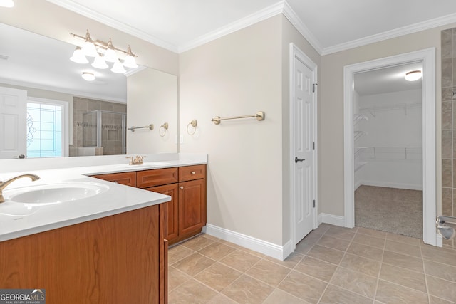 bathroom featuring ornamental molding, vanity, and tile patterned flooring