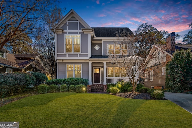 view of front of home with a yard