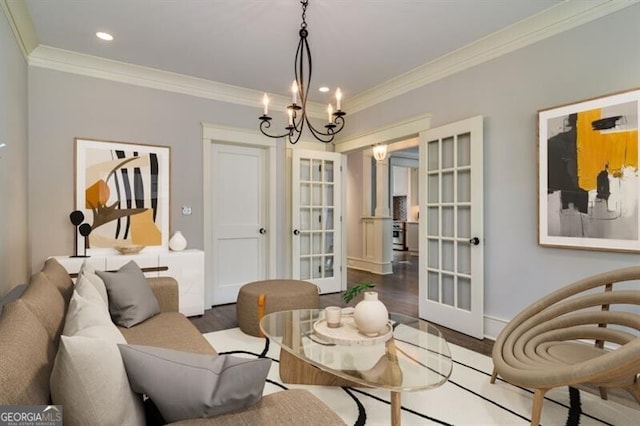 living room with crown molding, wood-type flooring, and french doors