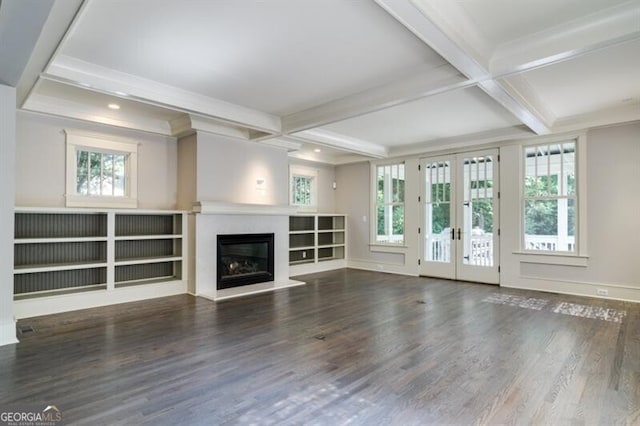 unfurnished living room featuring plenty of natural light, french doors, and wood-type flooring