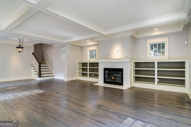 unfurnished living room featuring beamed ceiling, hardwood / wood-style flooring, and ornamental molding