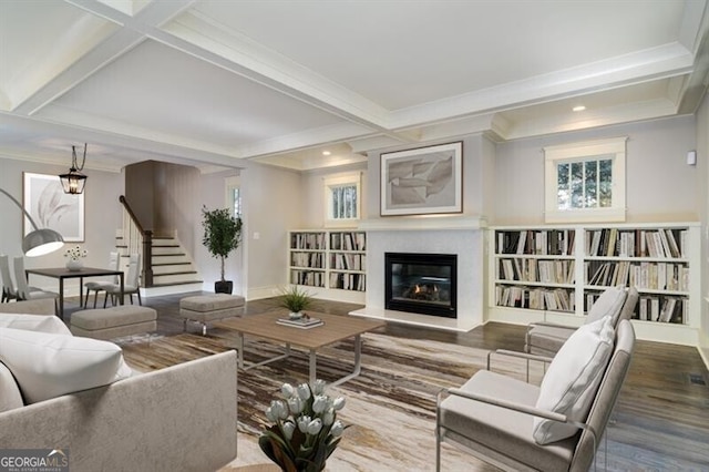 living room featuring beam ceiling, crown molding, and hardwood / wood-style floors