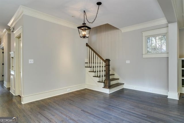 interior space featuring ornamental molding and dark hardwood / wood-style flooring