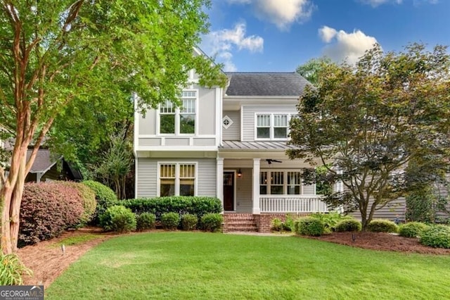 view of front of home featuring a front yard and covered porch