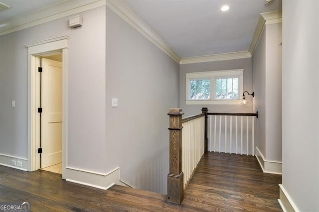 stairway featuring hardwood / wood-style floors and ornamental molding