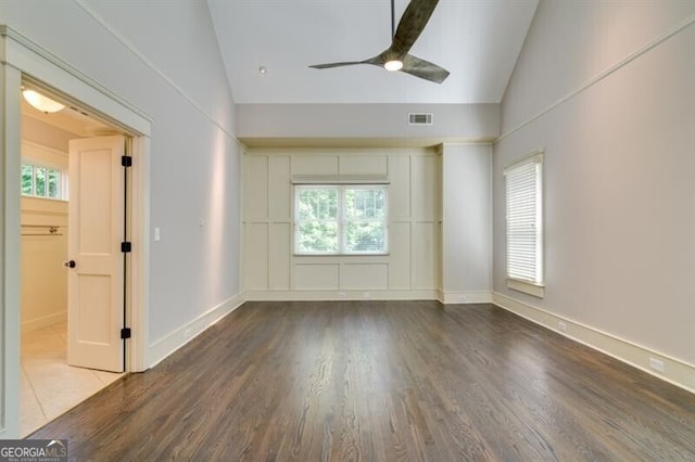 unfurnished room with ceiling fan, vaulted ceiling, and hardwood / wood-style floors