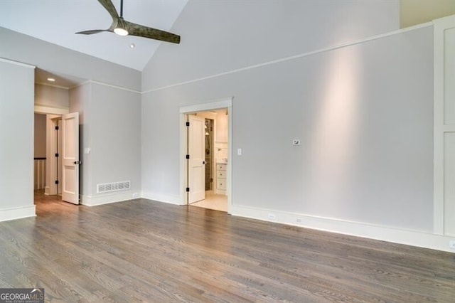 spare room featuring high vaulted ceiling, ceiling fan, and hardwood / wood-style floors