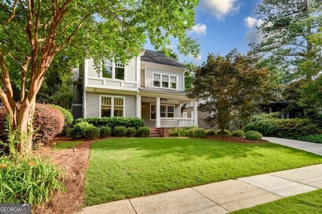 view of front of home featuring a porch and a front yard