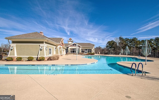 view of swimming pool with a patio