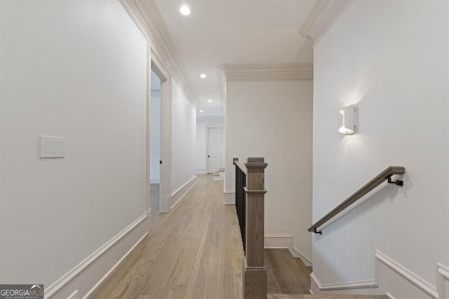 corridor featuring hardwood / wood-style floors and ornamental molding