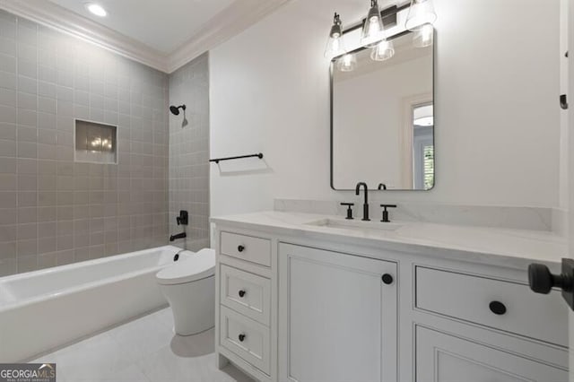 full bathroom with ornamental molding, vanity, tile patterned floors, tiled shower / bath, and toilet