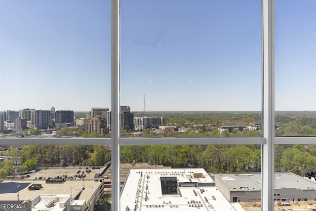 unfurnished sunroom with a view of city and a healthy amount of sunlight