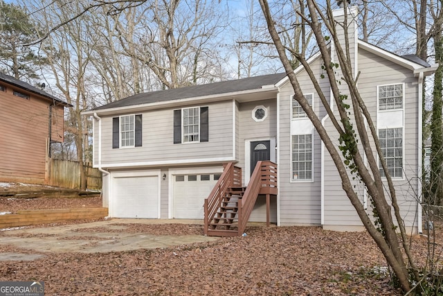 split foyer home featuring a garage