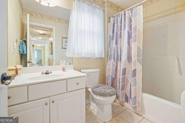 full bathroom featuring vanity, shower / tub combo, toilet, and tile patterned floors