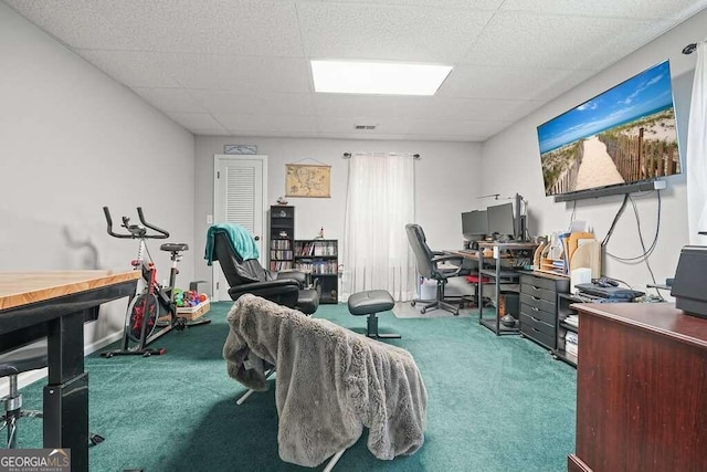 office with a paneled ceiling and carpet