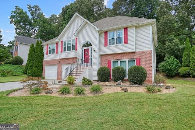 split foyer home featuring a front yard and a garage